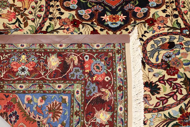 A part silk Tabriz rug, so-called 50 Raj, approx. 242 x 178 cm.