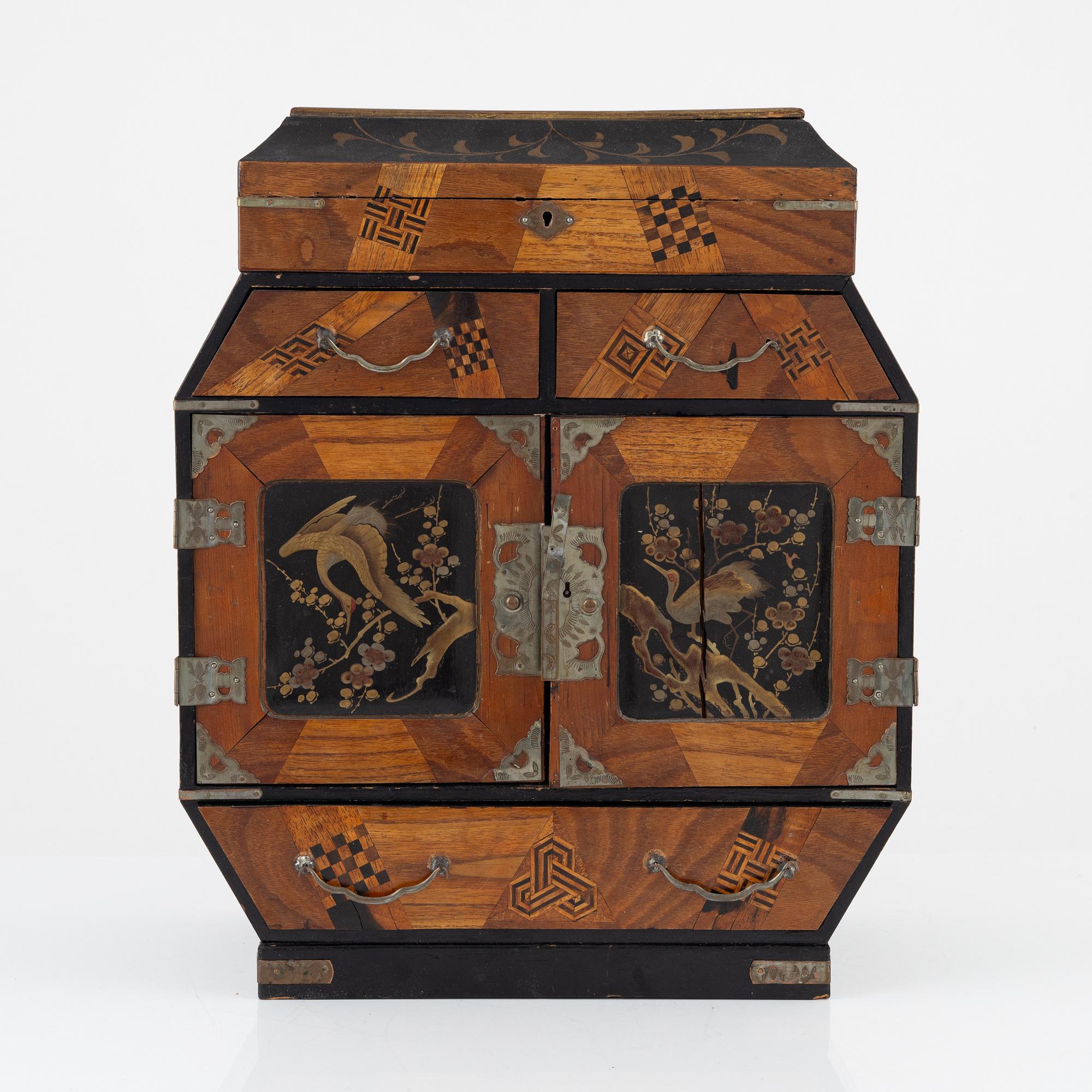 A Japenese partially lacquered hanging cabinet, early 20th century.