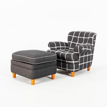 Josef Frank, a model '568' armchair and stool, Firma Svenskt Tenn, Sweden.