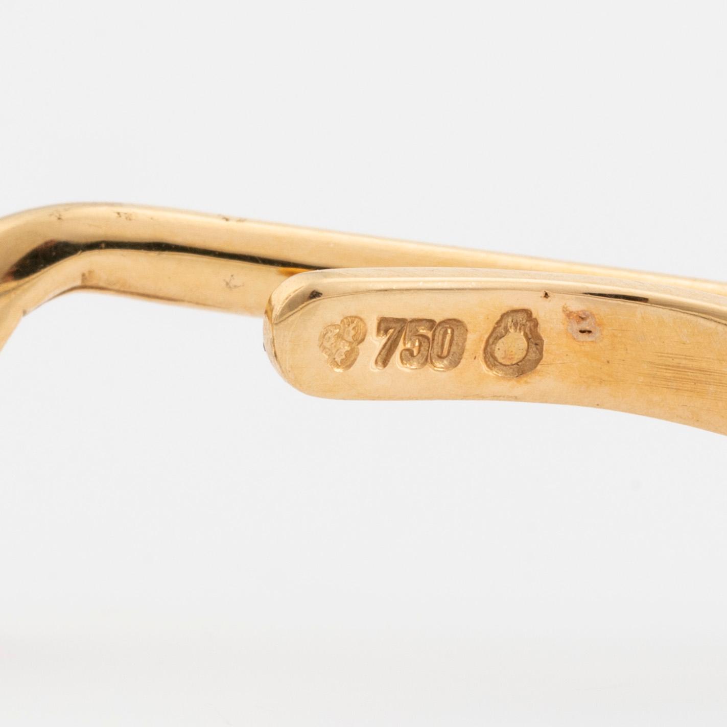 Slipsnål, 18K guld med briljantslipad diamant, i form av en golfklubba.