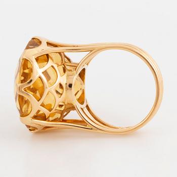 Round mixed-cut citrine cocktail ring.