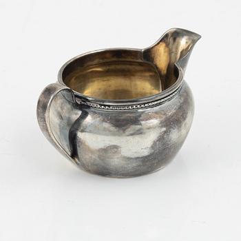 Three silver bowls and creamer, Sweden and Germany, 20th century.