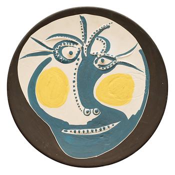 973. A Pablo Picasso earthenware dish 'Visage', Madoura, France 1960.