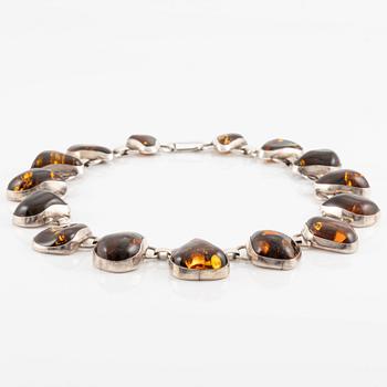 Necklace, sterling silver and amber.