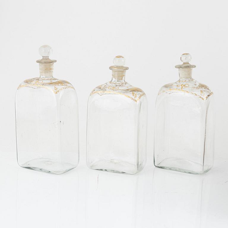 A box with twelve glass bottles, first half of the 19th Century.