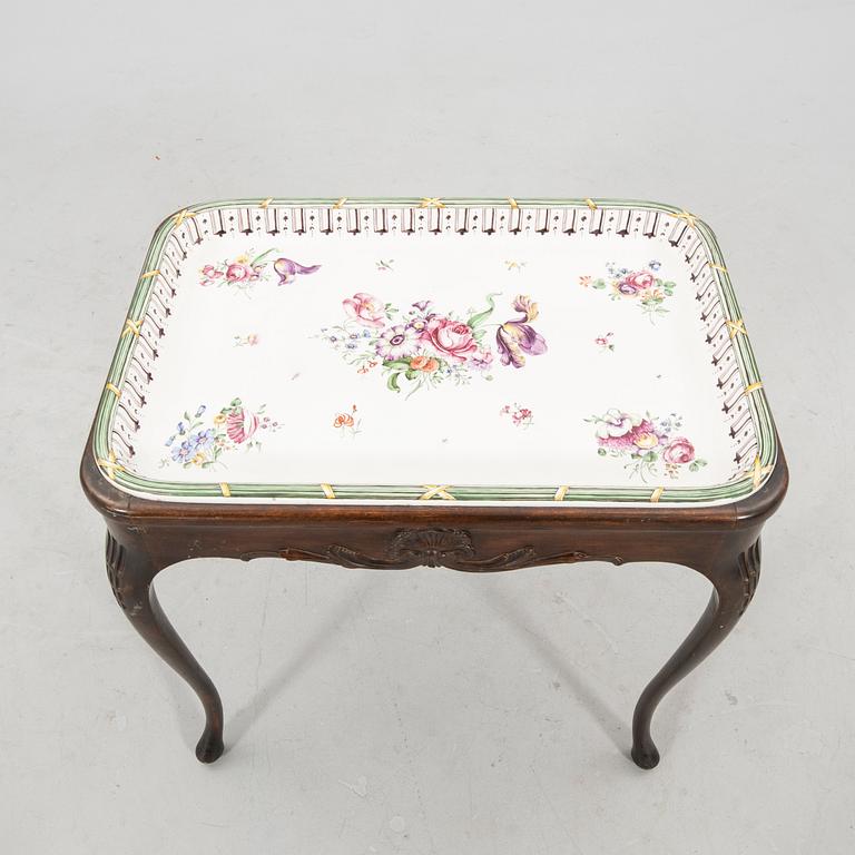 Rococo-style tea table signed and dated Rörstrand 1918 porcelain.