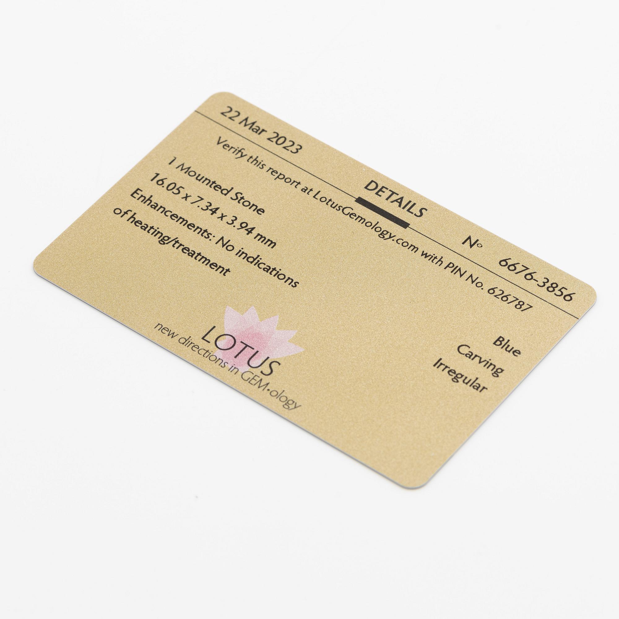 Pendant, 18K gold with carved sapphires, white sapphire, and a small rose-cut diamond.