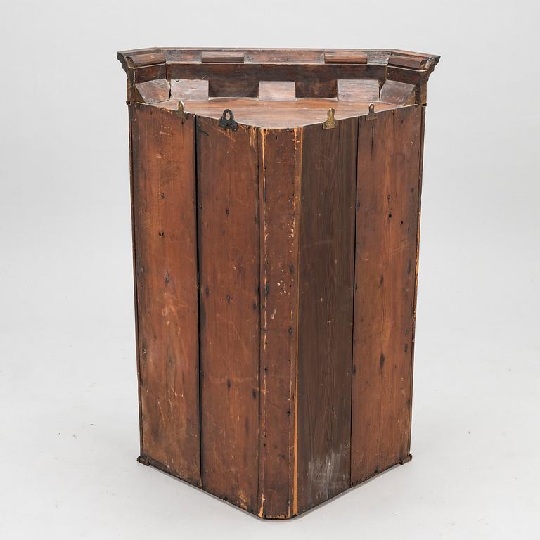 A 19th Century wall mounted corner cabinet.