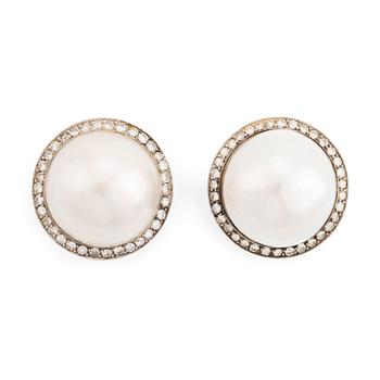 474. A pair of 18K white gold earrings set with cultured mabe pearls and round brilliant-cut diamonds.