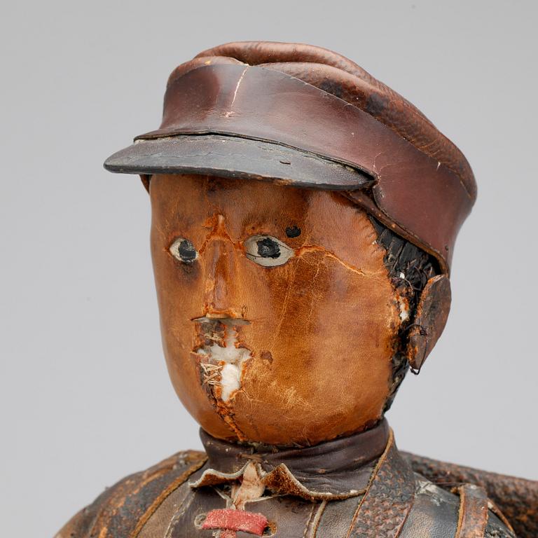 DOCKA, läder, 1800-tal.