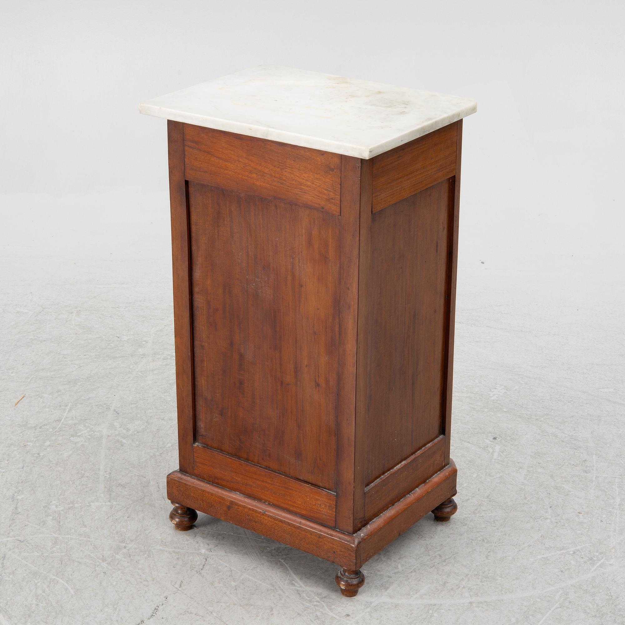 A bedside table, circa 1900.