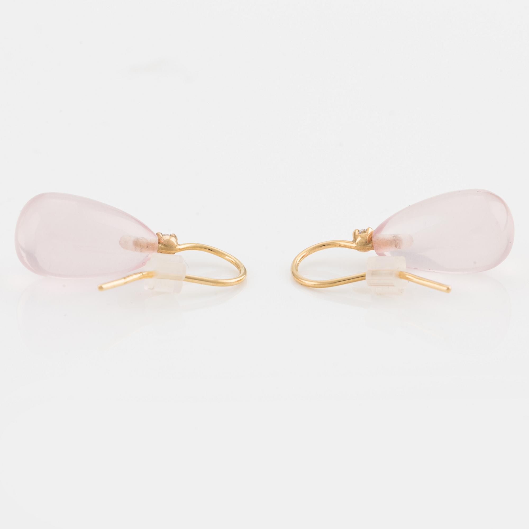 A pair of 18K gold earrings with rose quartz and round brilliant-cut diamonds.