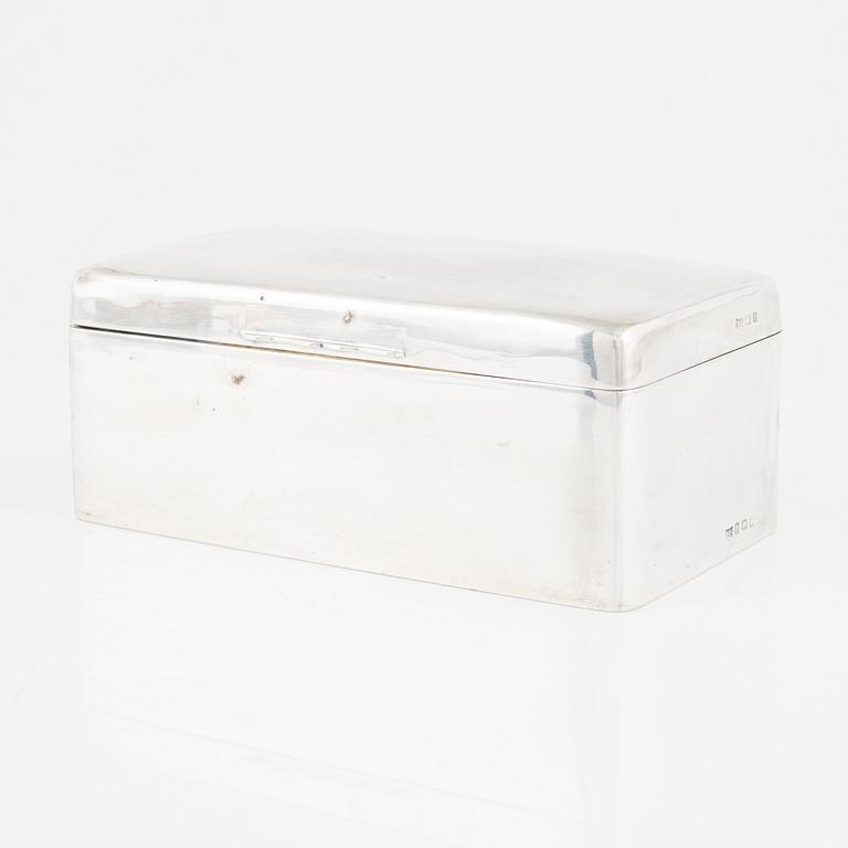 A silver cigarette box, Walker & Hall, Birmingham, England, 1919.