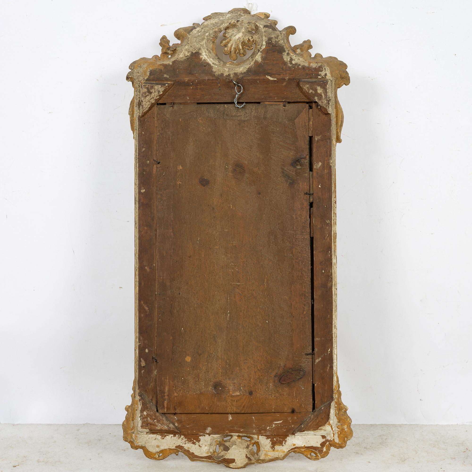 A giltwood rococo mirror, Stockholm, later part 18th century.