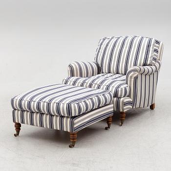 An armchair with a footstool, later part of the 20th century.