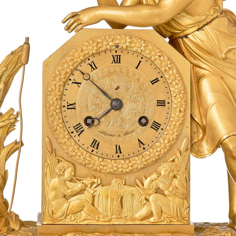 A French Empire ormolu and patinated bronze mantel clock, Paris, early 19th century.