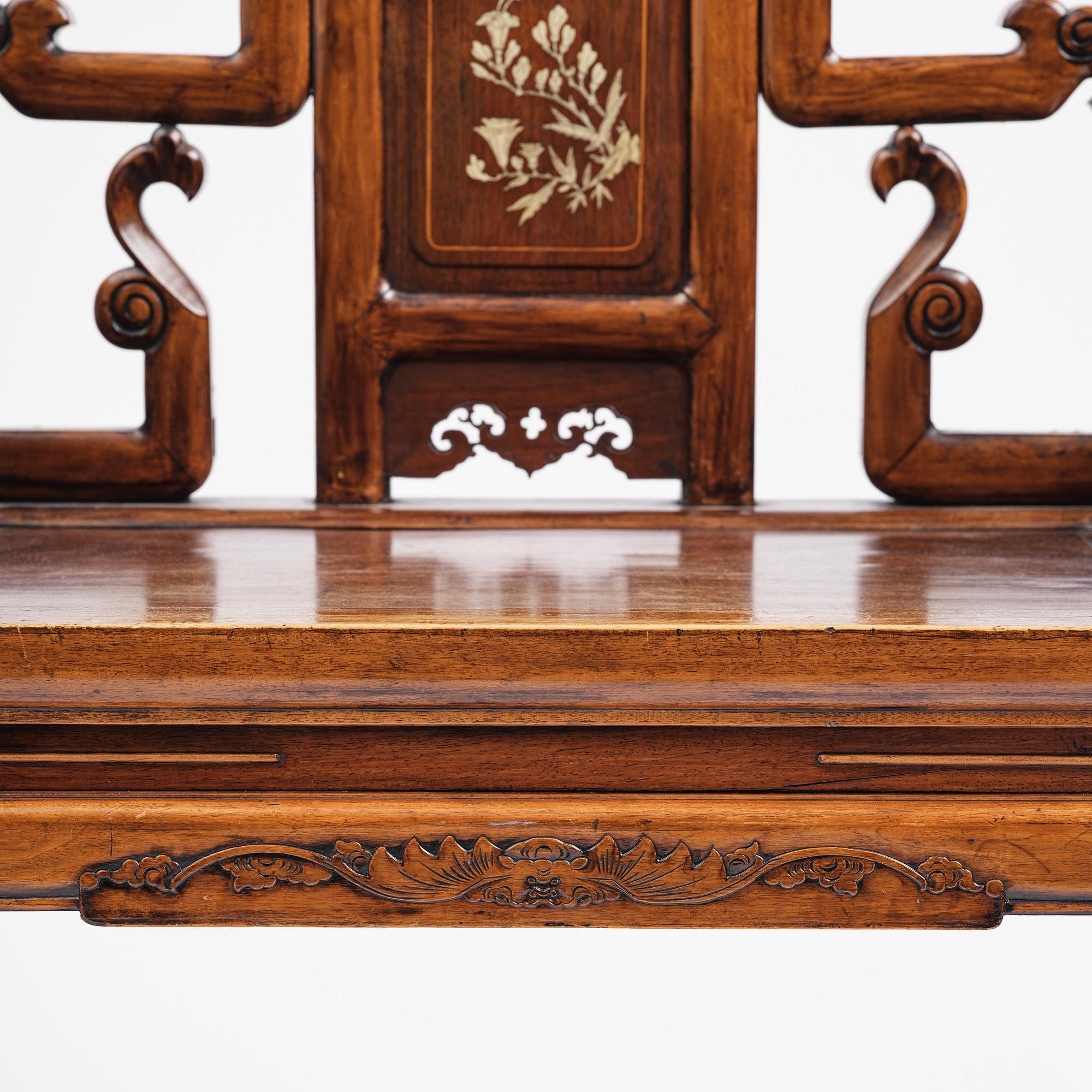 A pair of hardwood armchairs, late Qing dynasty.
