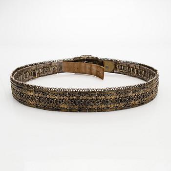 A Caucasian parcel-gilt costume belt with niello decor, 1908-26.