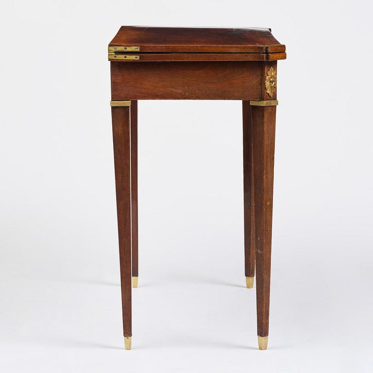 A Gustavian 'concertina action' mahogany games table by Georg Haupt (master in Stockholm 1770-84).