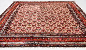 An antique Indian carpet, c 390 x 299 cm.