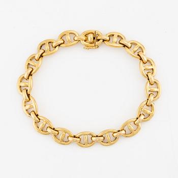 An 18K gold Cartier bracelet.