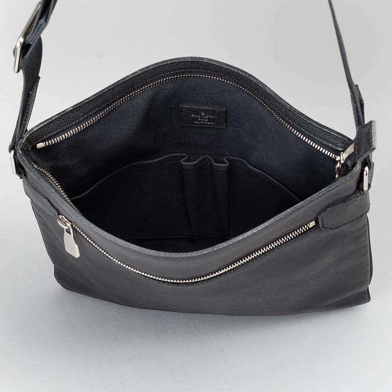 LOUIS VUITTON, a black Taiga bag, 2012.