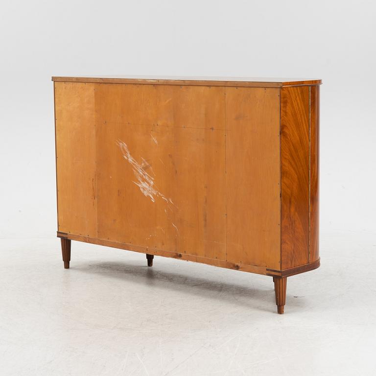 A 1940s mahogany veneered cabinet.