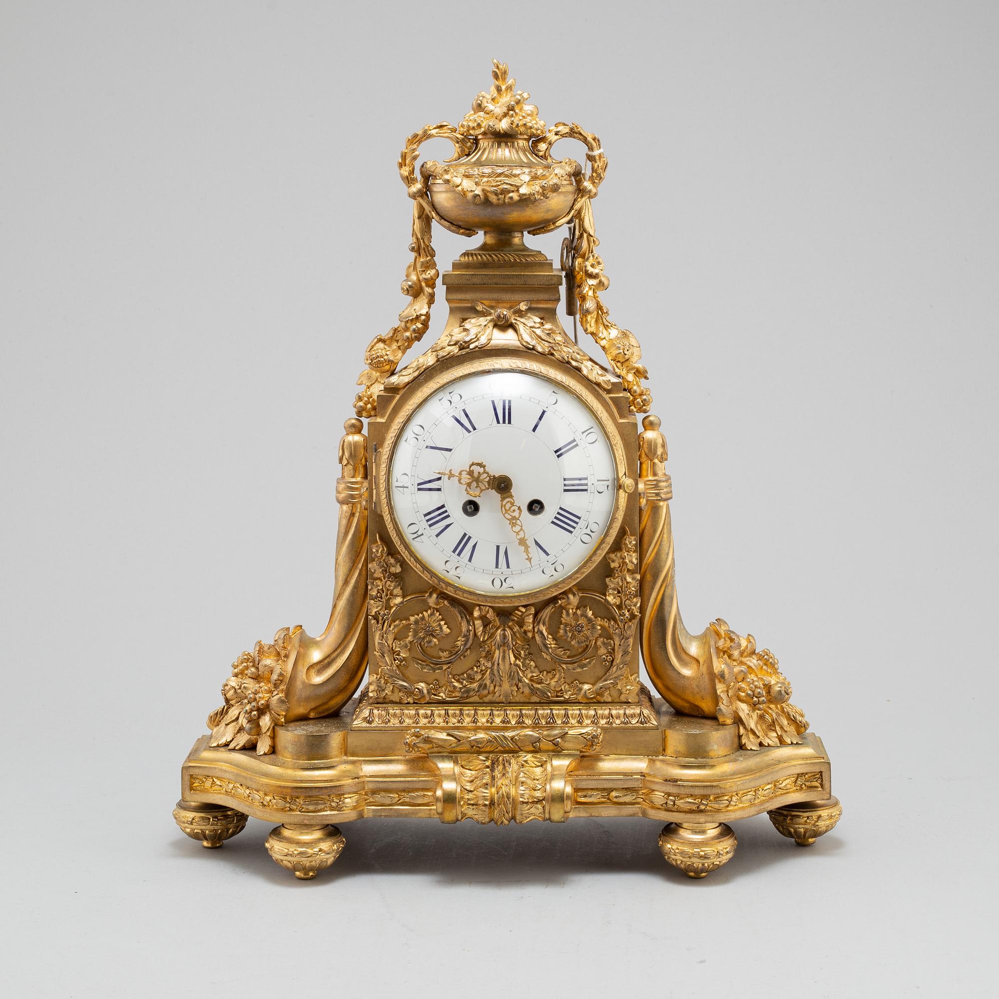 A FRENCH BRONZE MANTEL CLOCK, second half of the 19th century.