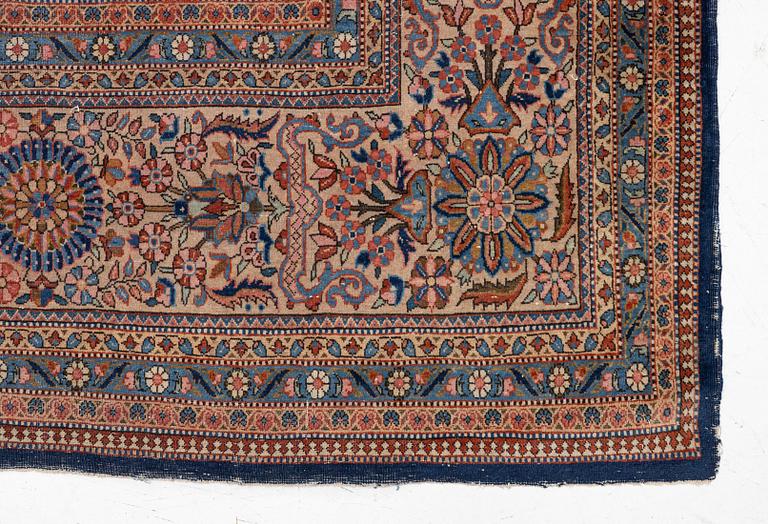 An oriental carpet, c. 425 x 305 cm.