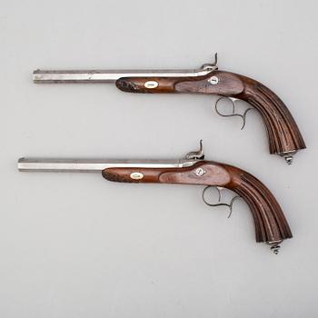 A mid 19th century pair of percussion pistols.