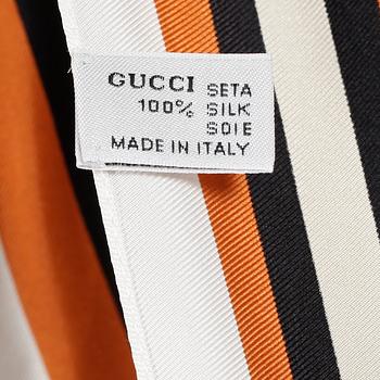 GUCCI, a silk top.
