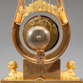 A late Gustavian early 19th century gilt bronze mantel clock.