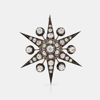1121. A Victorian old-cut diamond star brooch/pendant.
