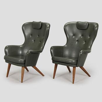 A pair of mid-20th century armchairs.