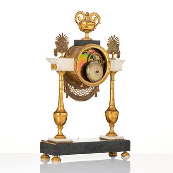 A late Louis XVI ormolu and marble portico clock, Paris, latge 18th century.