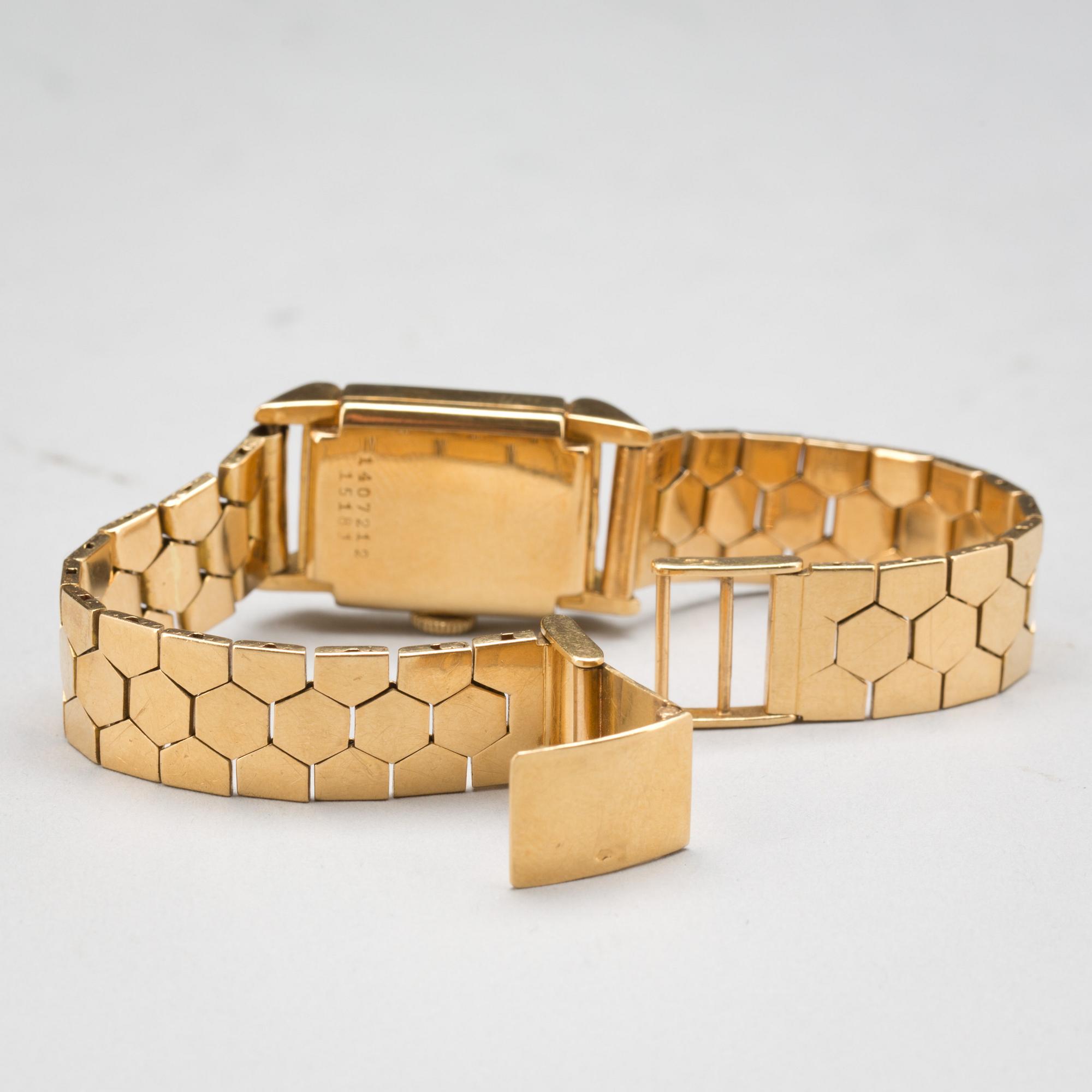 DAMARMBANDSUR, 18 k guld, Universal, Geneve. Vikt ca 39 g. Vikten avser även boett.