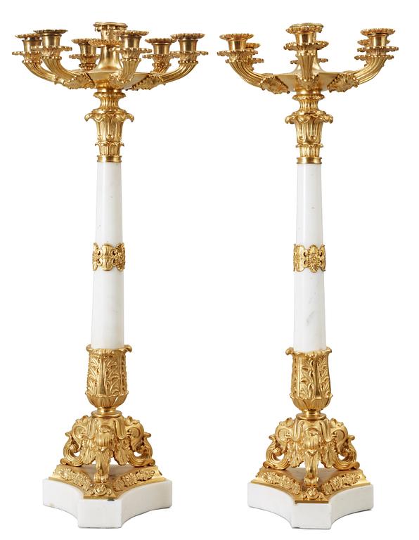 A pair of Empire-style circa 1900 seven-light candelabra.