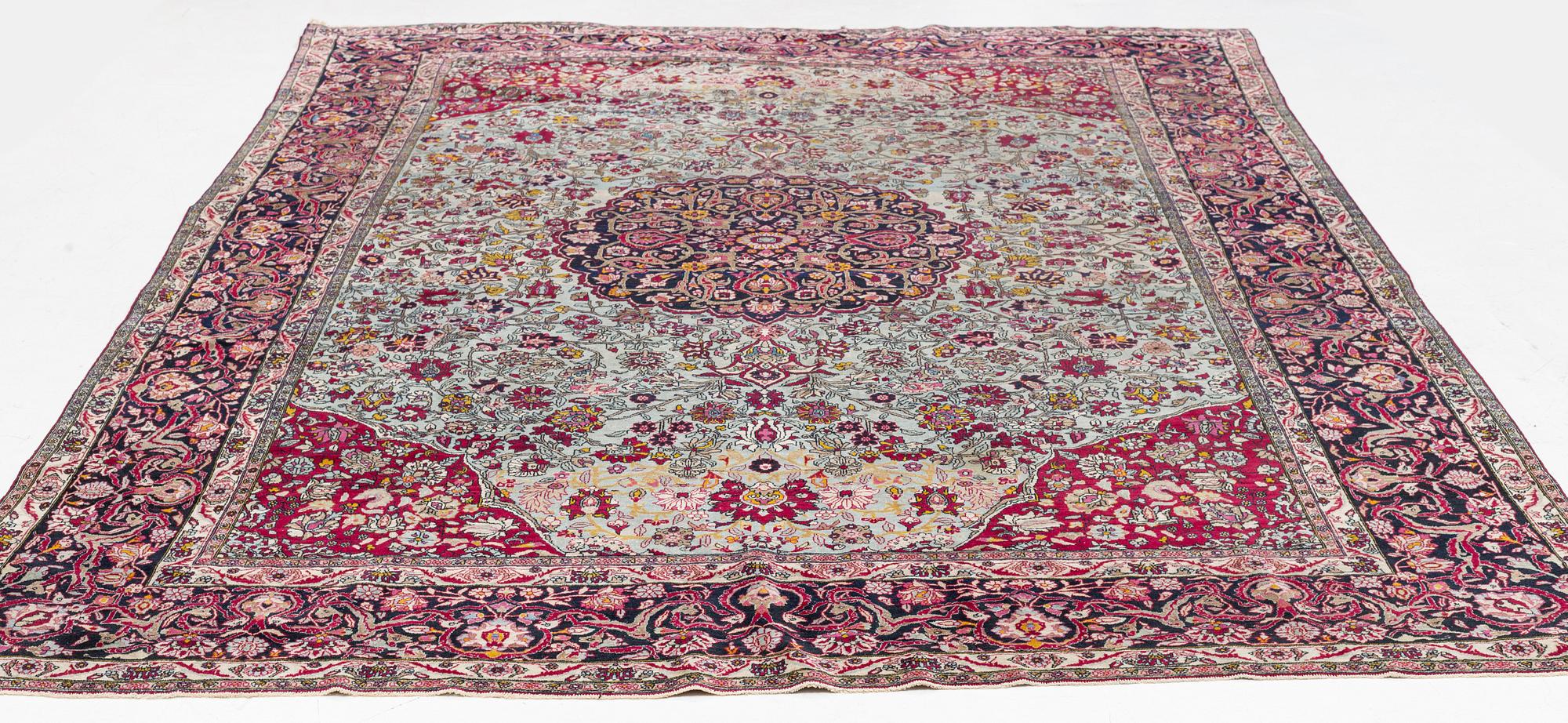 An antique Isfahan carpet, circa 342 x 250-260 cm.