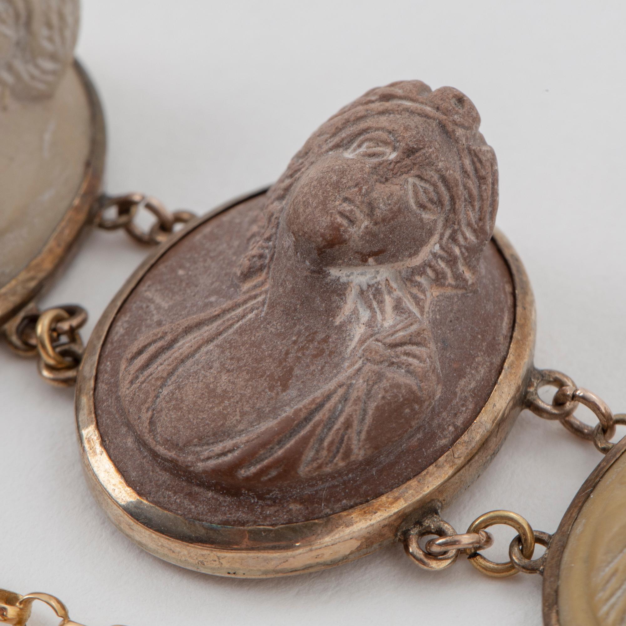 Silver and lava cameo necklace and bracelet.