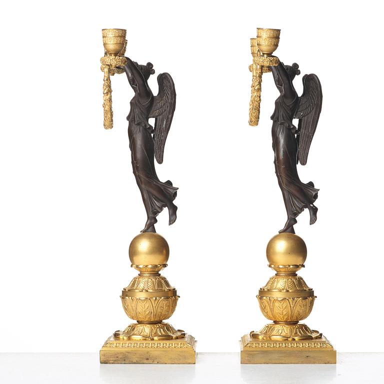 A pair of Empire two-light candlesticks, beginning of the 1800's.