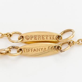 Tiffany & Co, Elsa Peretti, an 18K gold "Teardrop" necklace with a rock crystal pendant.