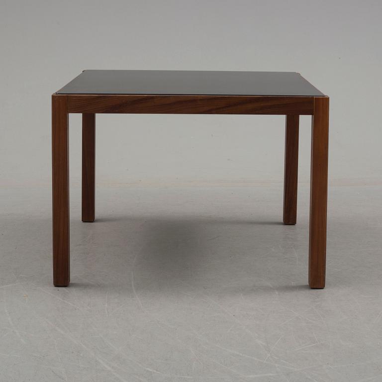 A 1960's teak coffee table with glass top.