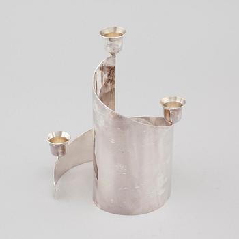 A candle holder in silver, unidentified designer, made by MEMA in linköping 1993. Weight 581 g.