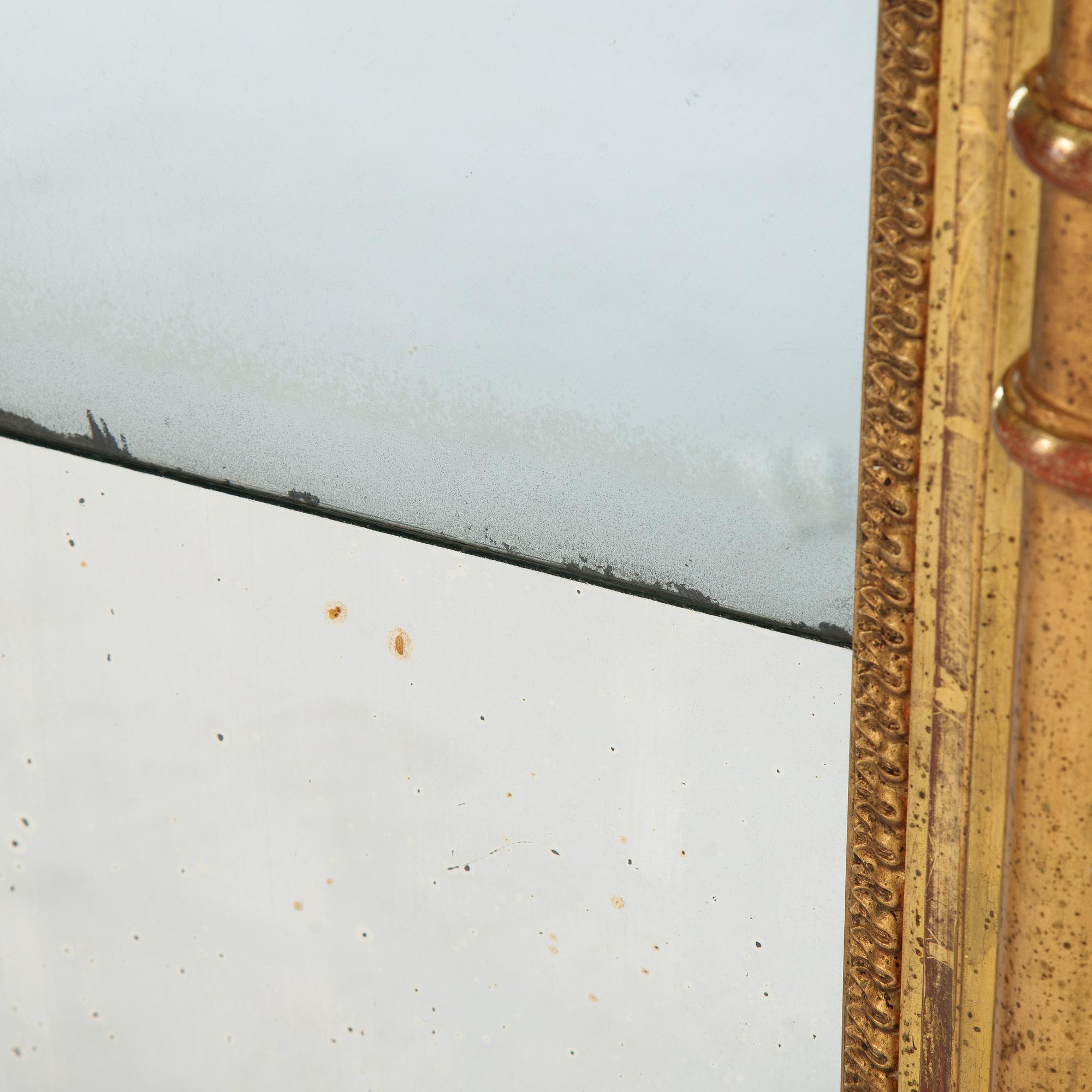 An Swedish Empire mirror, first half of the 19th century, attributed to Petter Gustaf Bylander, (Gothenburg 1802-59).