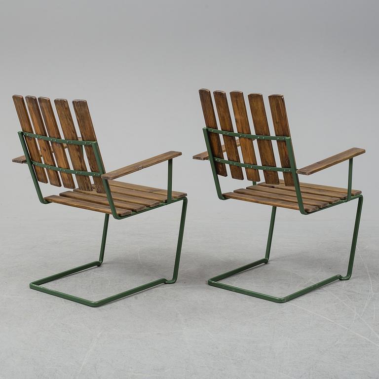 A pair of model A" armchairs from Grythyttan Stålmöbler.