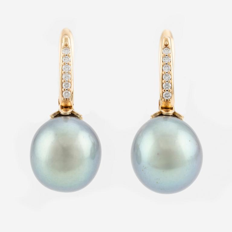 A pair of earrings with cultured freshwater pearls and round brilliant-cut diamonds.