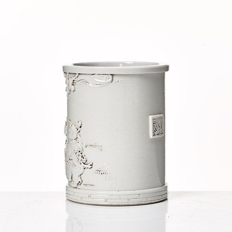 A white glazed Chinese brush pot, presumably late Qing dynasty.