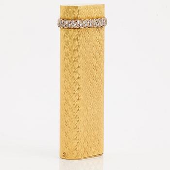 A cigarette lighter by Cartier set with single cut diamonds.