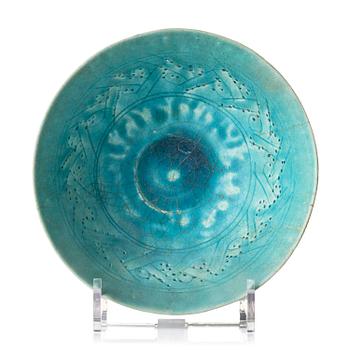 405. A Kashan Turquoise glazed conical pottery bowl, central Persia, 13th century.