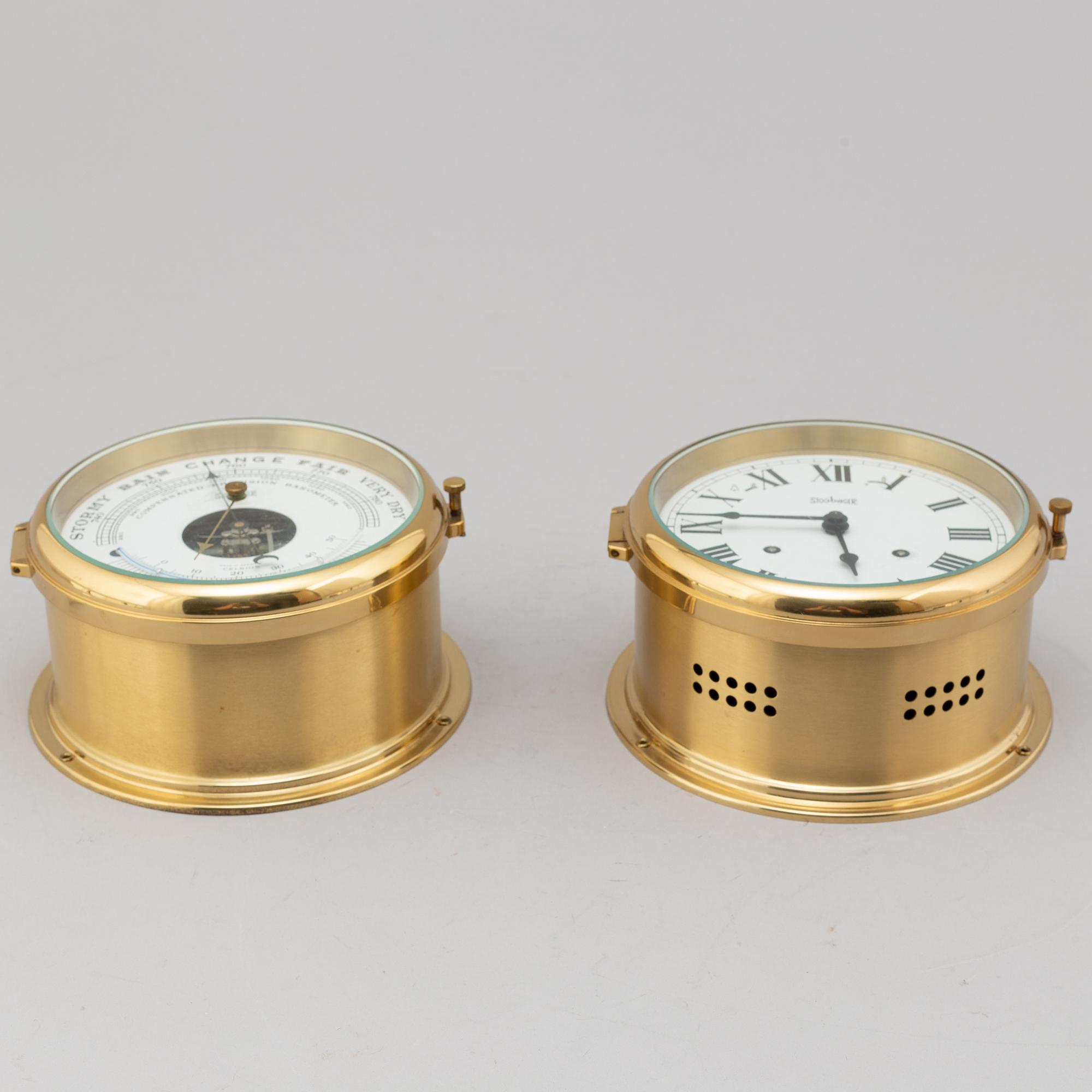 A BRASS MARINE CLOCK AND BAROMETER BY STOCKBURGER.
